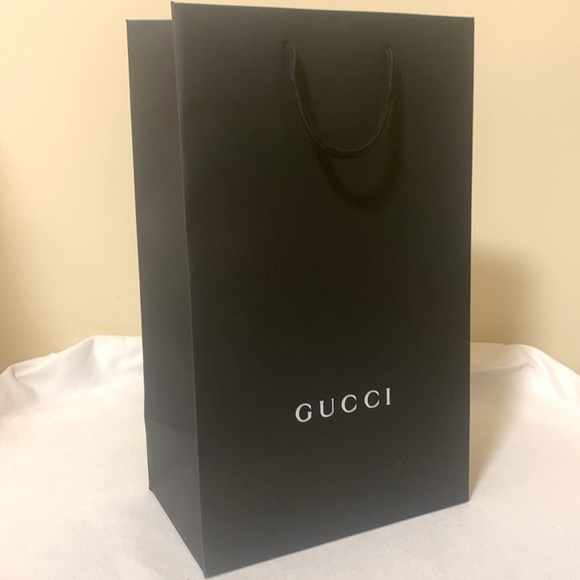 Gucci Handbags - Gucci shopping bag tall paper with woven handles.